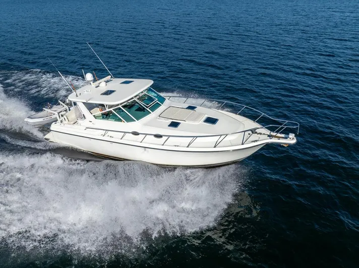  Yacht Photos Pics 2001 Tiara Sport 4000 EXPRESS yacht cruising on open water.