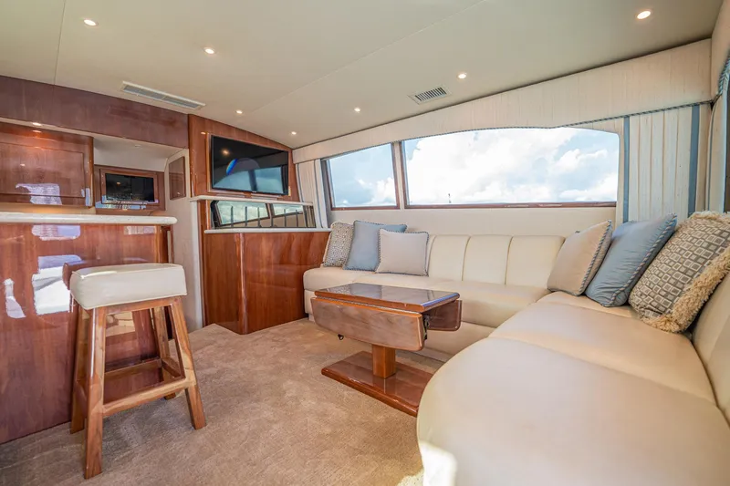 Manana Yacht Photos Pics Luxurious interior of 2007 Egg Harbor 43 SportYacht with plush seating and elegant wood finishes.