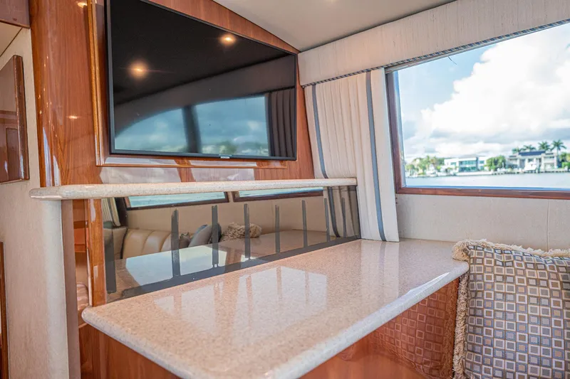Manana Yacht Photos Pics Luxurious interior of 2007 Egg Harbor 43 SportYacht with TV and waterfront view.