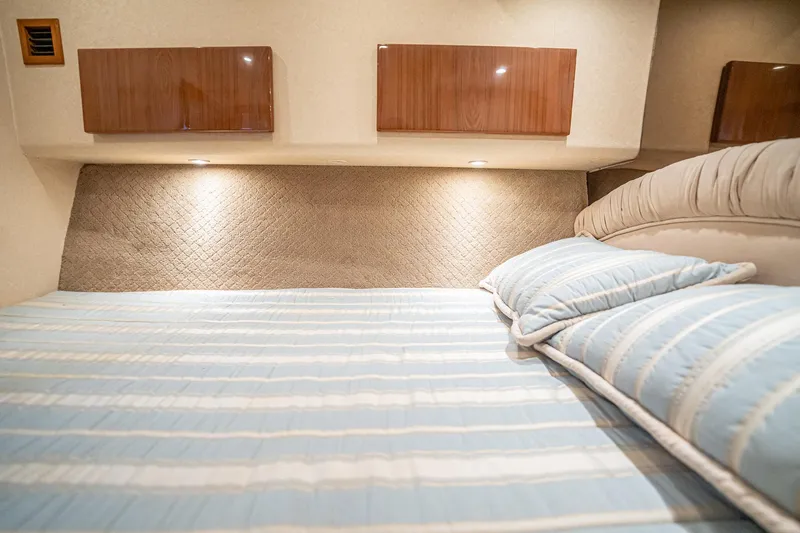 Manana Yacht Photos Pics Luxurious bedroom interior of 2007 Egg Harbor 43 SportYacht with striped bedding.