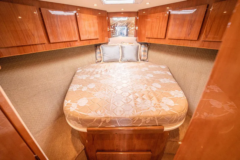 Manana Yacht Photos Pics Luxurious cabin interior of 2007 Egg Harbor 43 SportYacht with elegant wood finish.