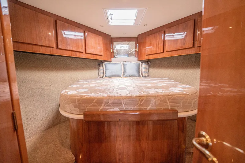 Manana Yacht Photos Pics Luxurious cabin interior of 2007 Egg Harbor 43 SportYacht with elegant wood finish.