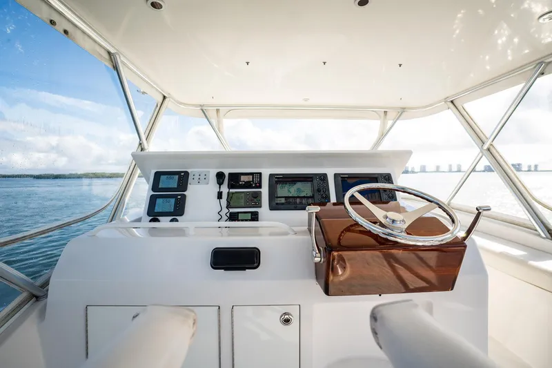 Manana Yacht Photos Pics Helm of 2007 Egg Harbor 43 SportYacht with navigation equipment and steering wheel.