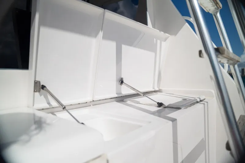 Manana Yacht Photos Pics 2007 Egg Harbor 43 SportYacht deck with open storage compartments and stainless steel fittings.