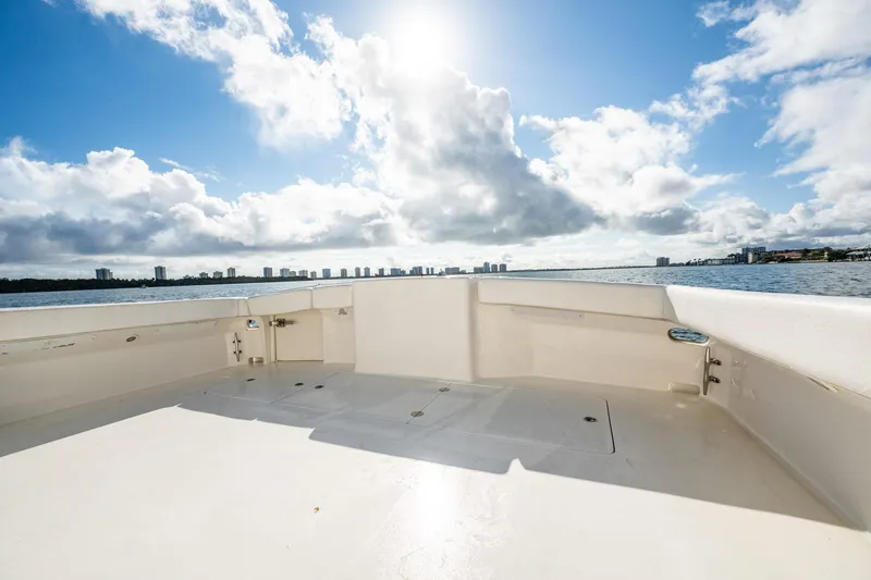 Manana Yacht Photos Pics 2007 Egg Harbor 43 SportYacht deck with ocean view under a bright, cloudy sky.