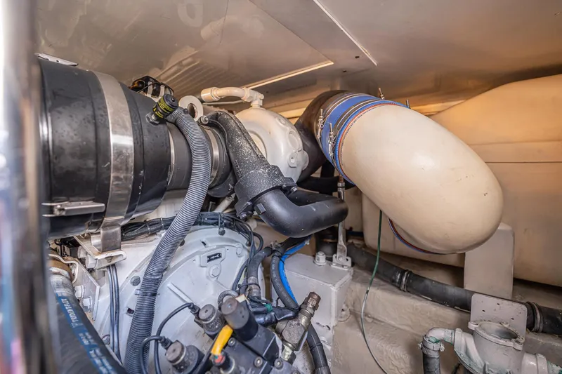 Manana Yacht Photos Pics Engine room of 2007 Egg Harbor 43 SportYacht showcasing mechanical components and piping.