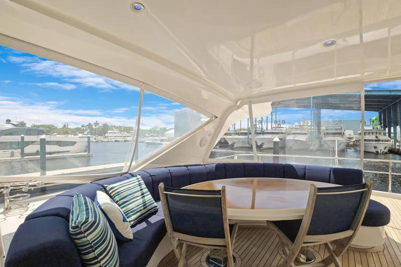 Her Endeavour Yacht Photos Pics Luxurious 2008 Marquis 690 yacht interior with elegant seating and marina view.