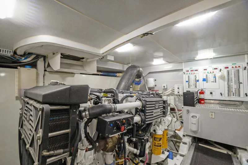Her Endeavour Yacht Photos Pics Engine room of a 2008 Marquis 690 yacht, featuring a CAT marine engine.