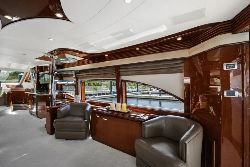 Her Endeavour Yacht Photos Pics Luxurious interior of a 2008 Marquis 690 yacht with elegant seating and polished wood finishes.