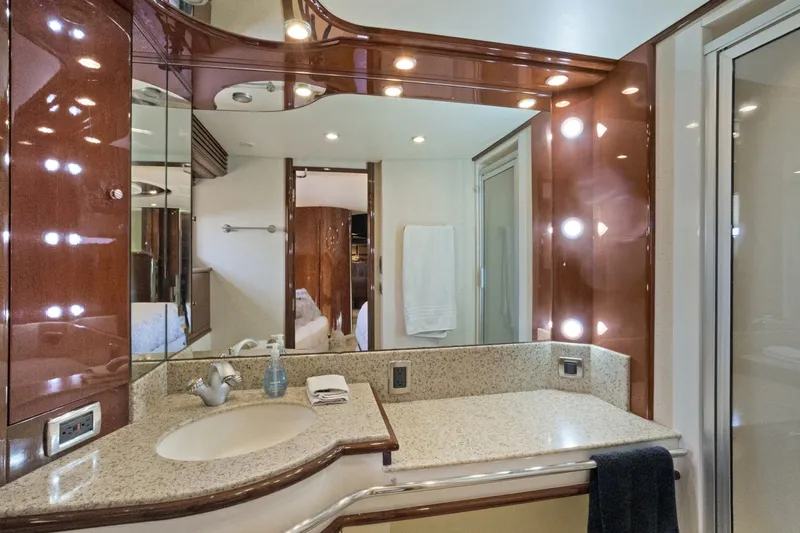 Her Endeavour Yacht Photos Pics Luxurious bathroom in 2008 Marquis 690 yacht with elegant lighting and modern fixtures.