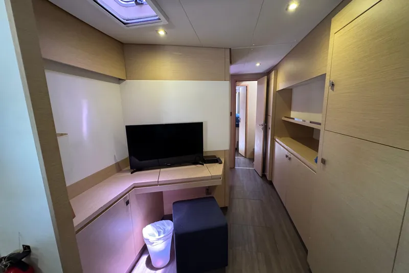 Ten:10 Yacht Photos Pics Interior of 2017 Fountaine Pajot SABA 50 yacht with modern furnishings and TV.