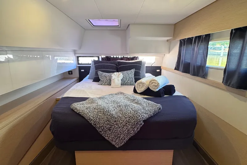 Ten:10 Yacht Photos Pics Luxurious cabin interior of 2017 Fountaine Pajot SABA 50 yacht with cozy bedding.