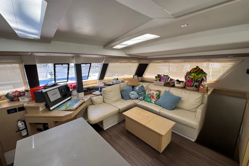 Ten:10 Yacht Photos Pics Interior of 2017 Fountaine Pajot SABA 50 yacht with cozy seating and navigation equipment.