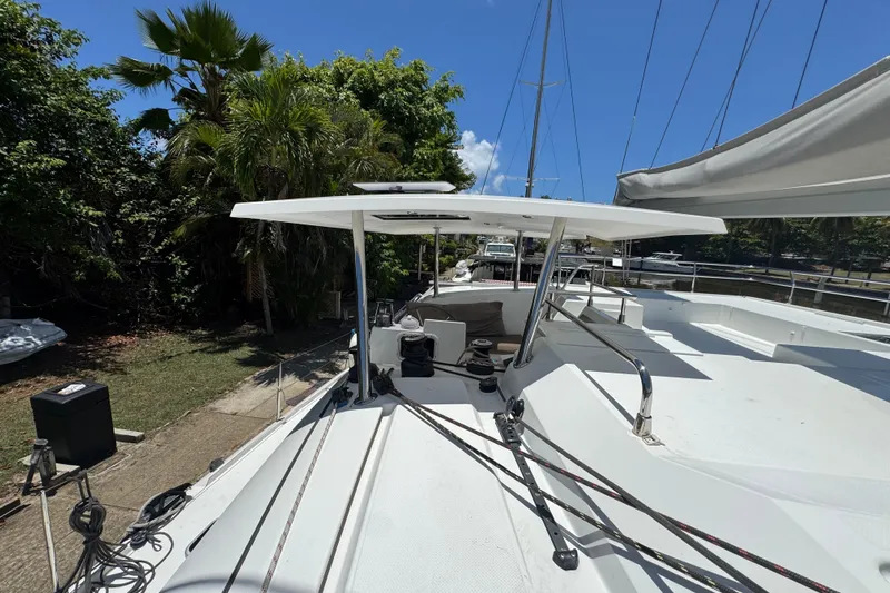 Ten:10 Yacht Photos Pics 2017 Fountaine Pajot SABA 50 catamaran deck with lush greenery and clear blue sky.