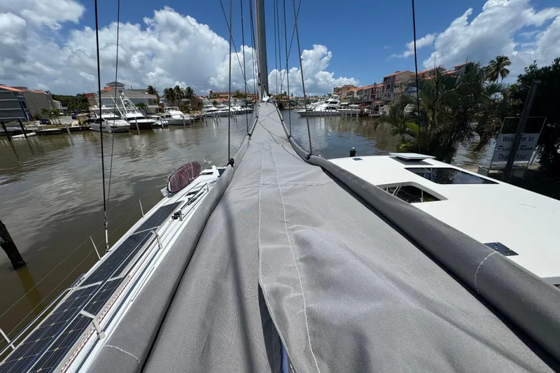 Ten:10 Yacht Photos Pics 2017 Fountaine Pajot SABA 50 catamaran docked in a sunny marina with solar panels.