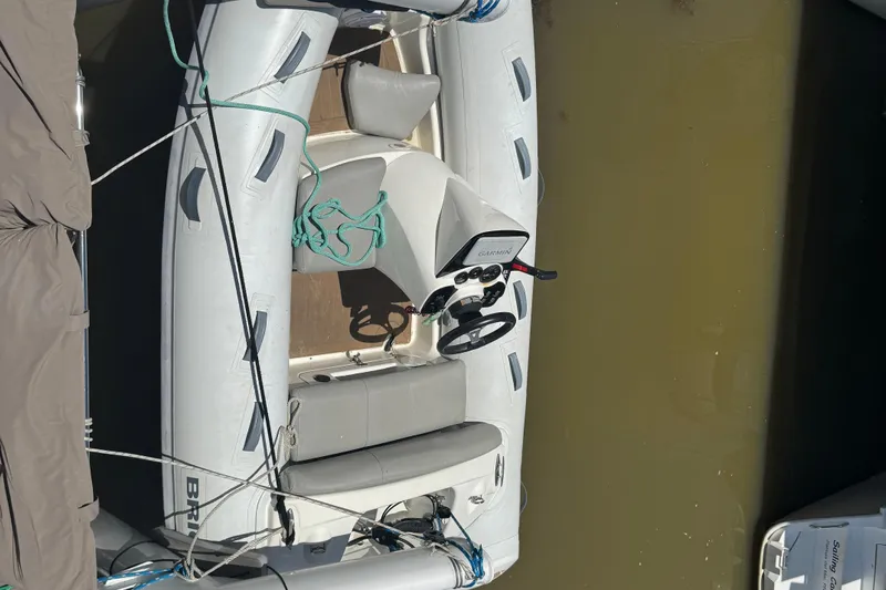 Ten:10 Yacht Photos Pics Inflatable boat docked beside a 2017 Fountaine Pajot SABA 50 catamaran.