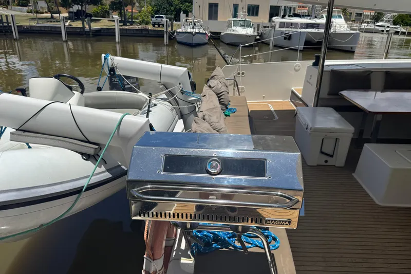 Ten:10 Yacht Photos Pics 2017 Fountaine Pajot SABA 50 yacht deck with grill and inflatable boat.