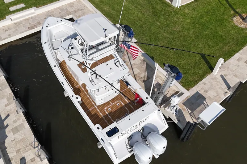  Yacht Photos Pics 2018 Everglades 335 Center Console boat docked, aerial view, with American flag.