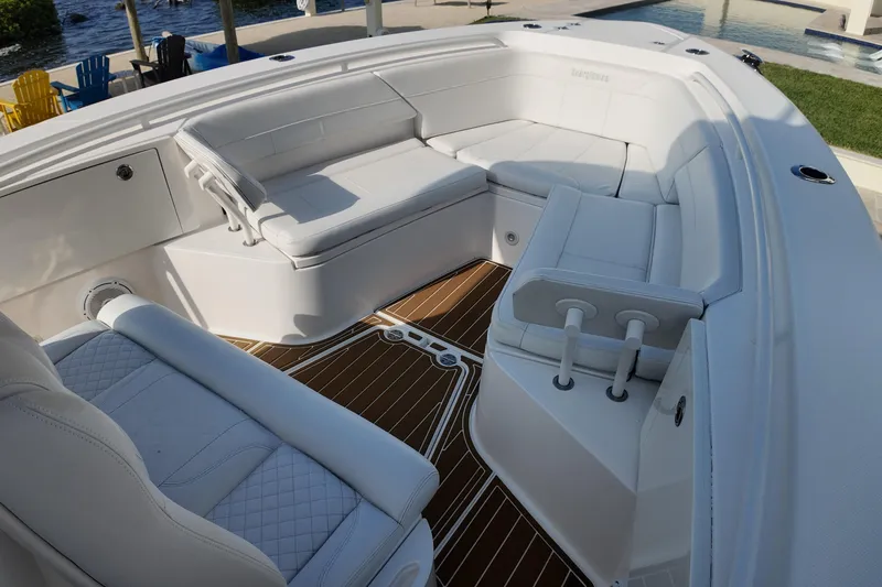  Yacht Photos Pics 2018 Everglades 335 Center Console boat with luxurious white seating and teak flooring.