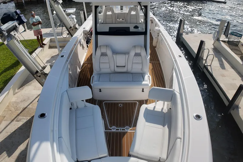  Yacht Photos Pics 2018 Everglades 335 Center Console boat with luxurious seating and sleek design at a dock.