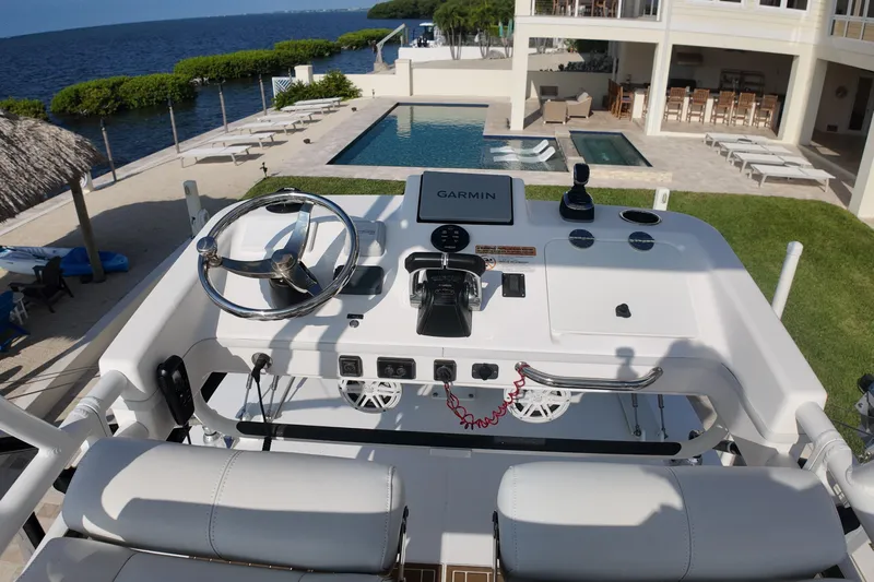  Yacht Photos Pics Helm of 2018 Everglades 335 Center Console overlooking pool and ocean view.