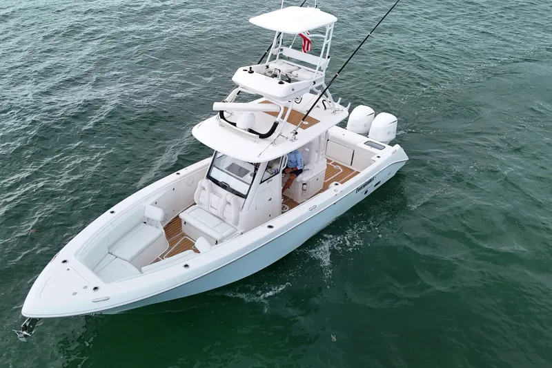  Yacht Photos Pics 2018 Everglades 335 Center Console boat cruising on open water.