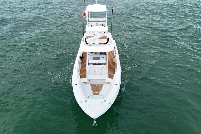  Yacht Photos Pics 2018 Everglades 335 Center Console boat on open water, aerial view.