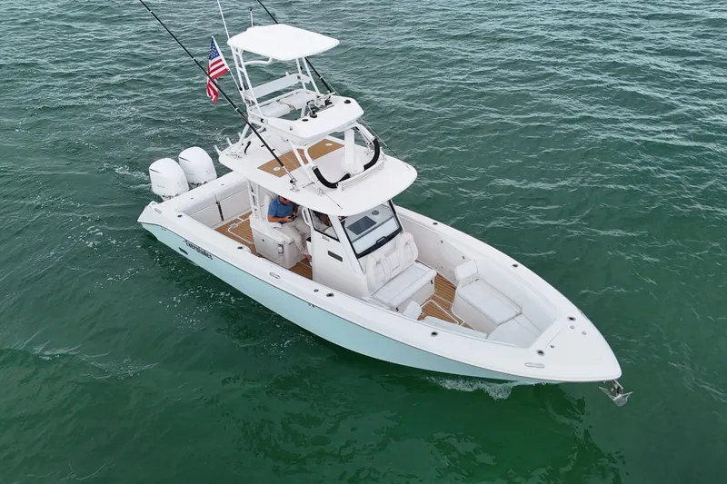  Yacht Photos Pics 2018 Everglades 335 Center Console boat cruising on open water, featuring dual engines.