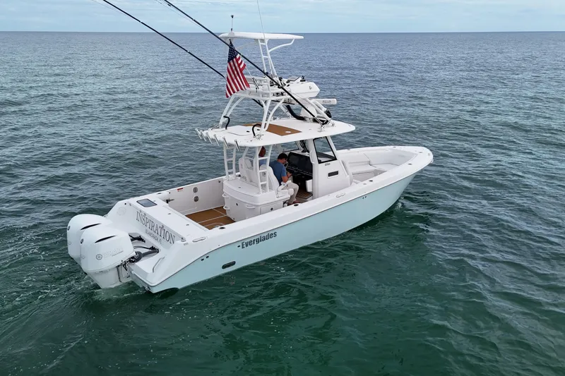  Yacht Photos Pics 2018 Everglades 335 Center Console boat on open water, featuring dual engines and American flag.