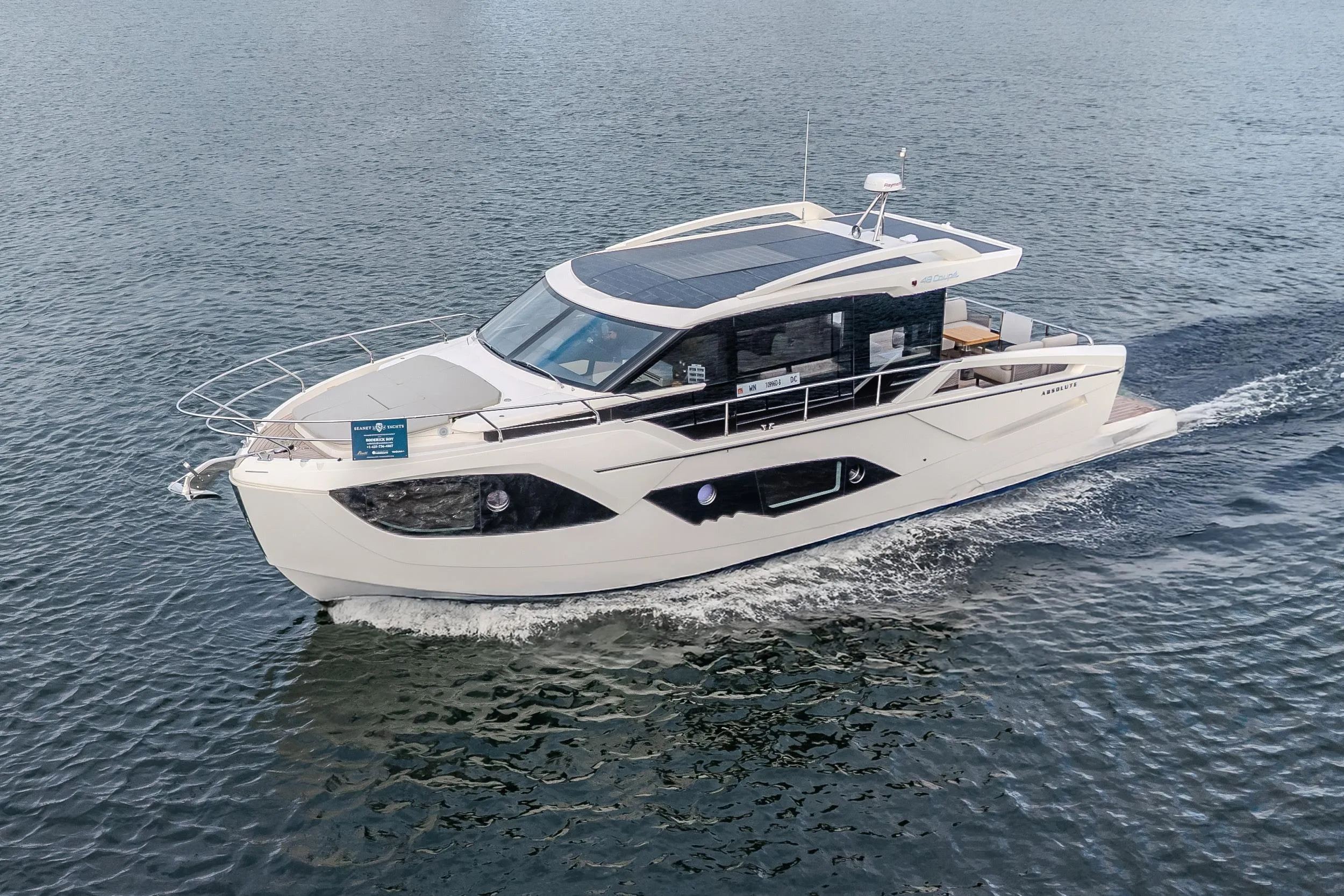 2026 Absolute 48 Coupe yacht cruising on open water.