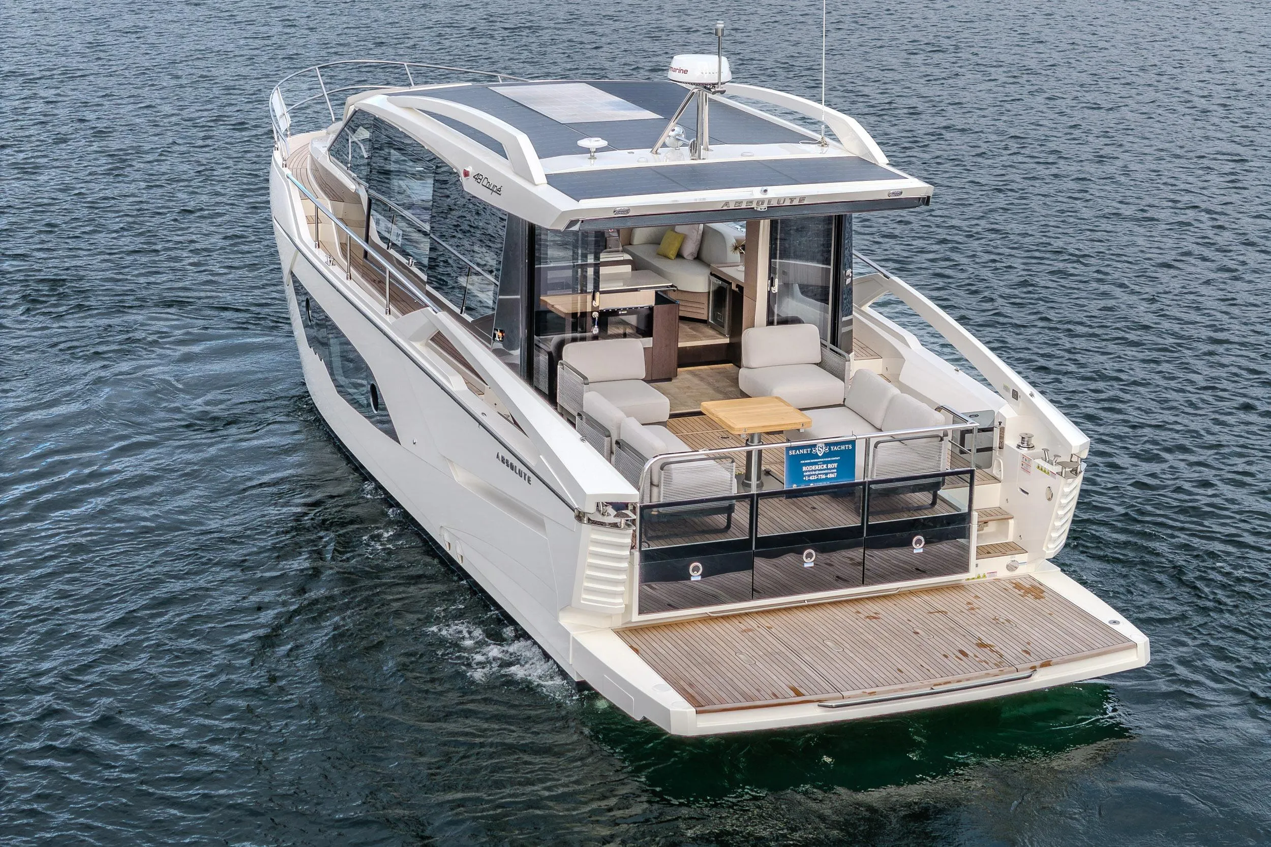 Luxury Absolute 48 Coupe yacht, 2026 model, cruising on open water.