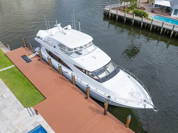 Corporate Approved 2 Yacht Photos Pics 2005 Hatteras 80 Motor Yacht docked by waterfront property.