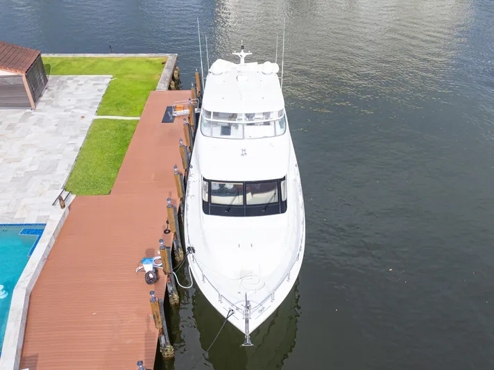 Corporate Approved 2 Yacht Photos Pics 2005 Hatteras 80 Motor Yacht docked by waterfront with pool and patio.