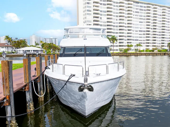 Corporate Approved 2 Yacht Photos Pics 2005 Hatteras 80 Motor Yacht docked near waterfront buildings.