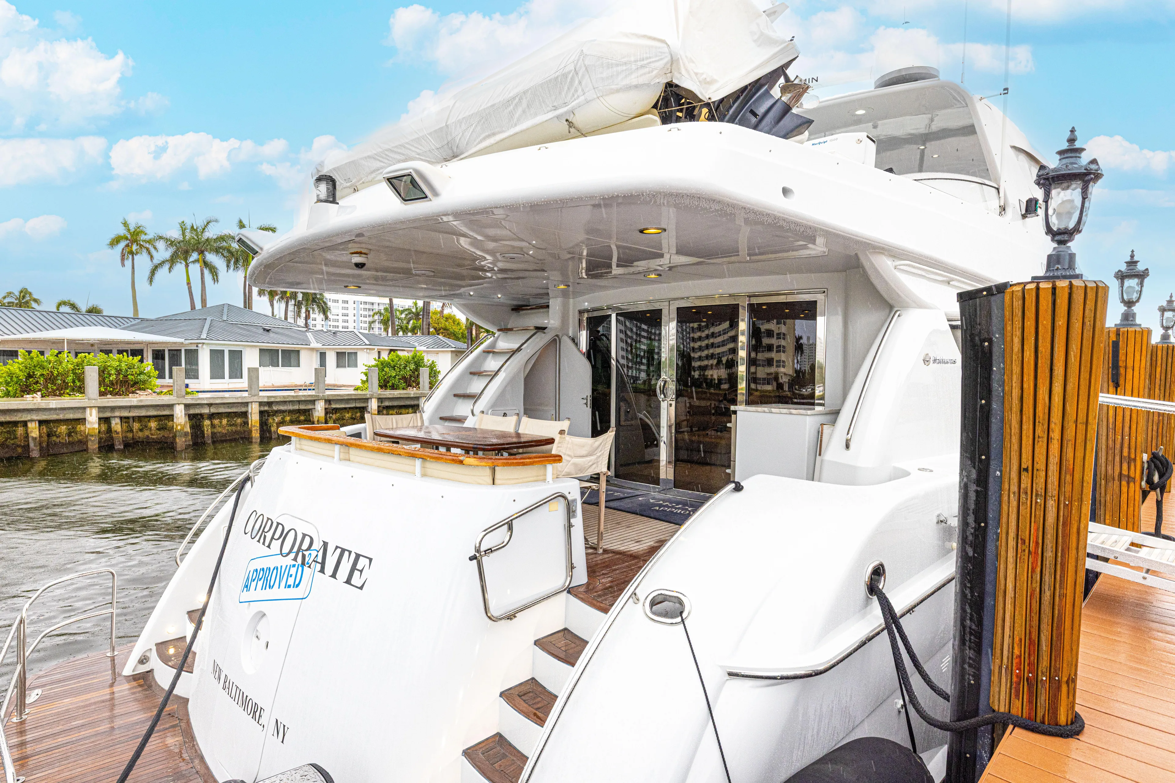 Corporate Approved 2 Yacht Photos Pics 2005 Hatteras 80 Motor Yacht docked, featuring spacious deck and elegant design.