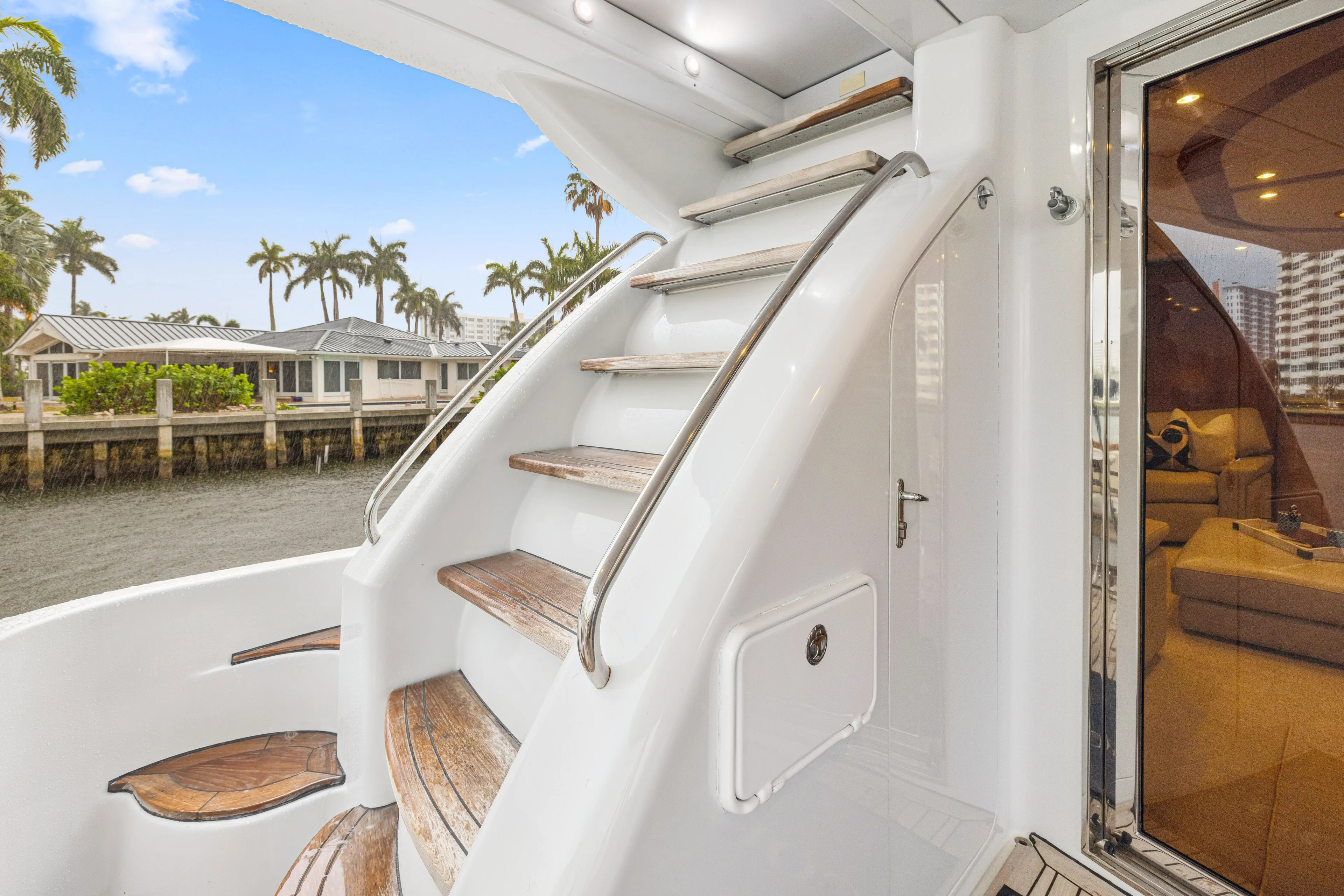 Corporate Approved 2 Yacht Photos Pics Staircase on 2005 Hatteras 80 Motor Yacht with waterfront view and luxurious interior.