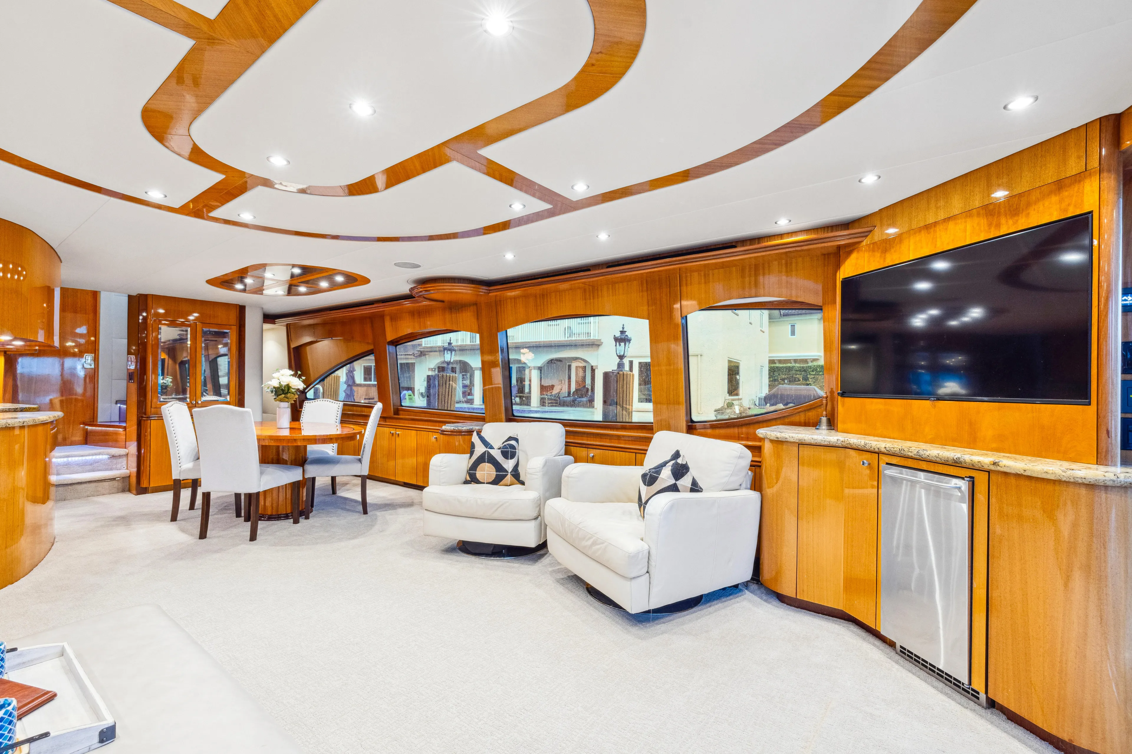 Corporate Approved 2 Yacht Photos Pics Luxurious interior of 2005 Hatteras 80 Motor Yacht with elegant seating and modern amenities.