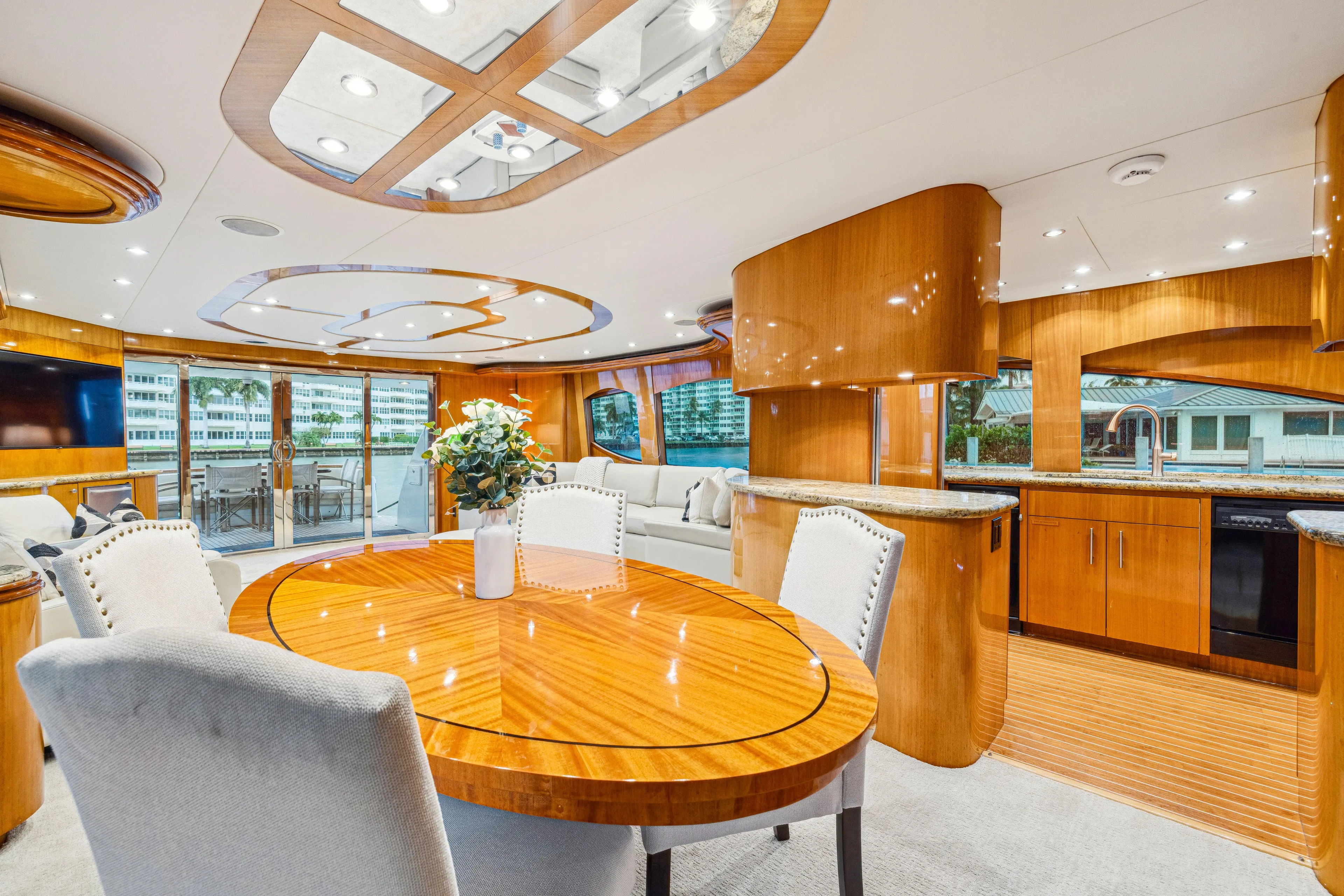 Corporate Approved 2 Yacht Photos Pics Luxurious interior of 2005 Hatteras 80 Motor Yacht with elegant dining area and modern kitchen.