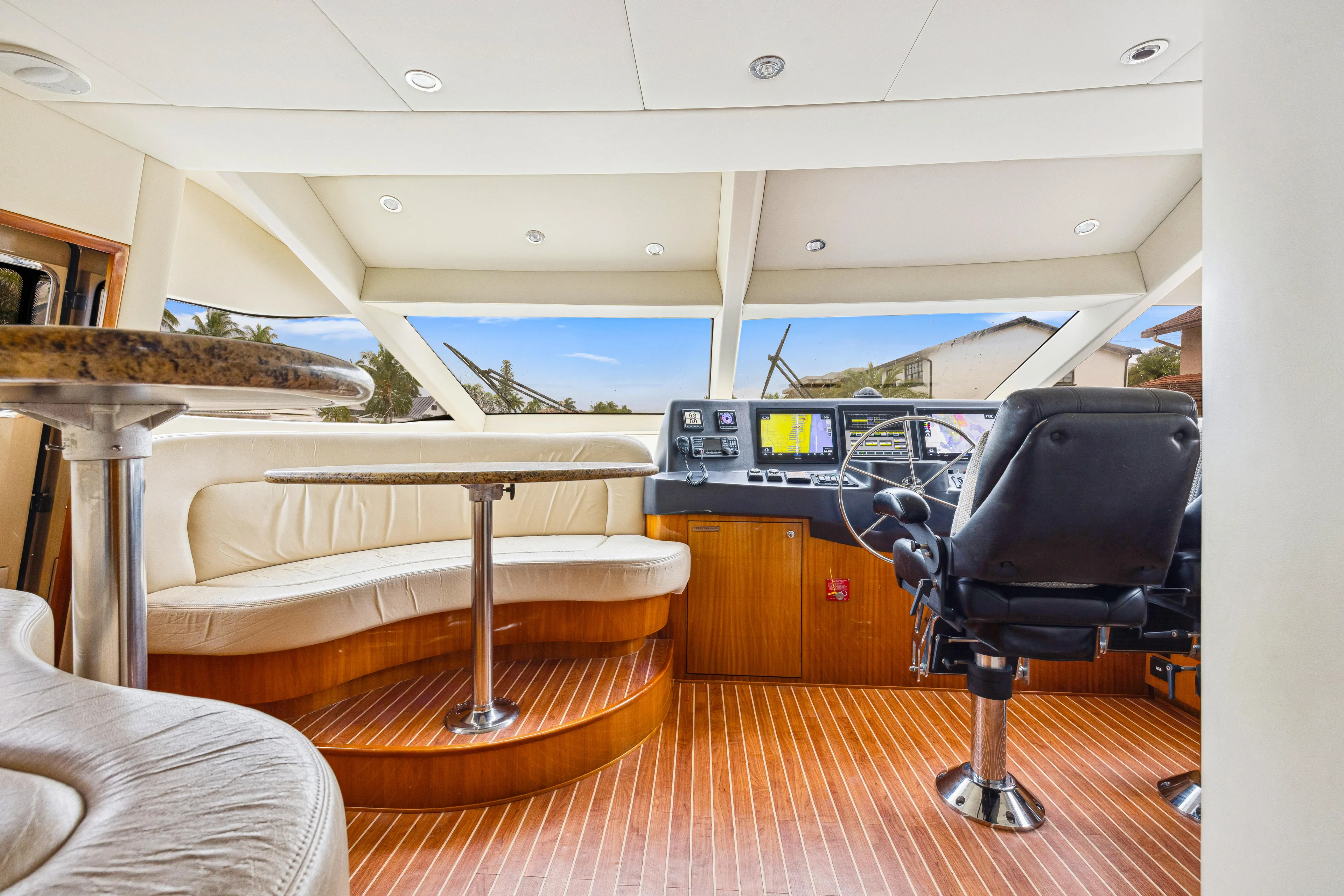 Corporate Approved 2 Yacht Photos Pics Interior of 2005 Hatteras 80 Motor Yacht with helm and seating area.