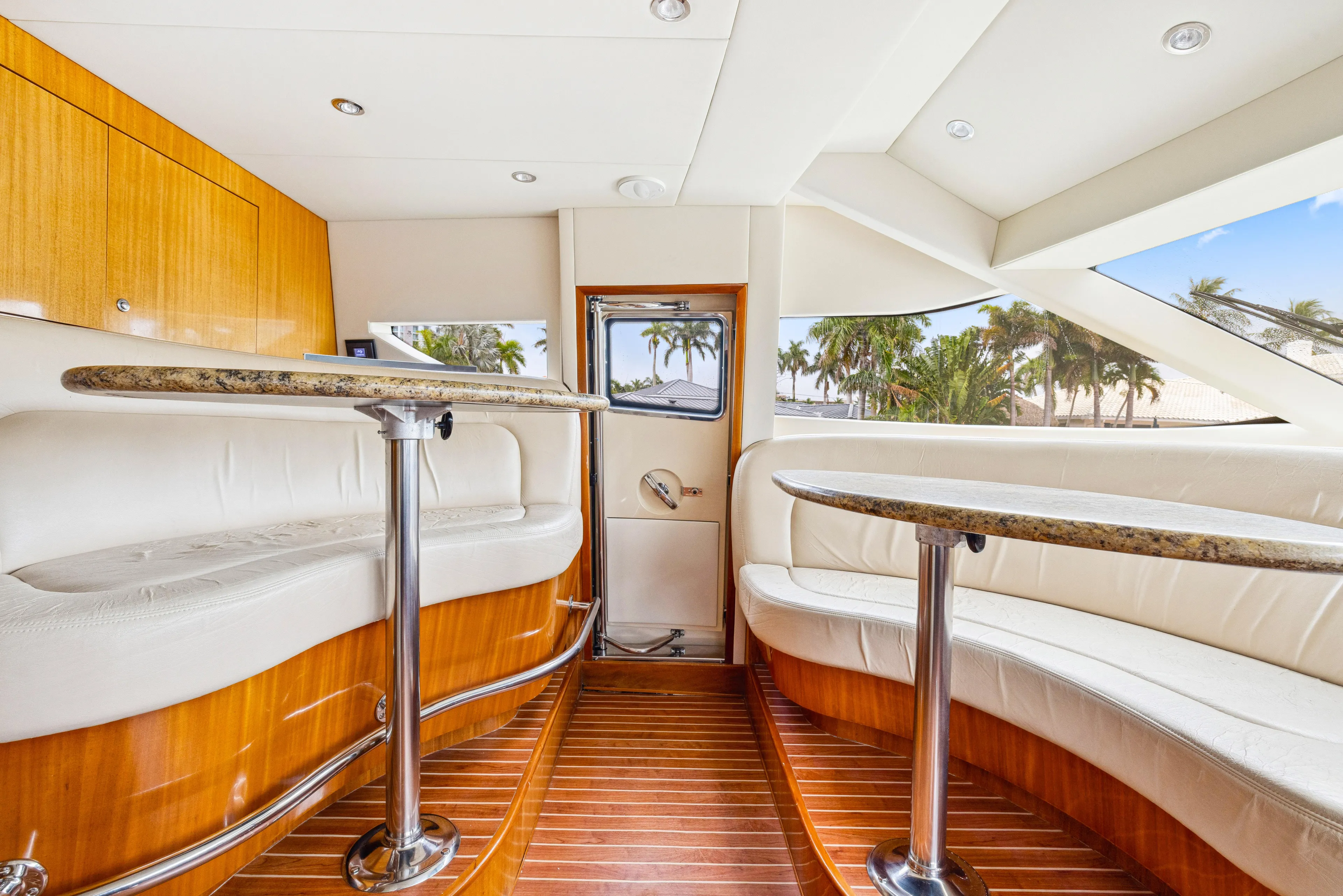 Corporate Approved 2 Yacht Photos Pics Luxurious interior of 2005 Hatteras 80 Motor Yacht with elegant seating and wood flooring.