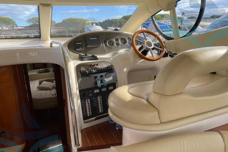  Yacht Photos Pics Luxurious 2001 Azimut 42 Fly yacht interior with elegant helm and plush seating.