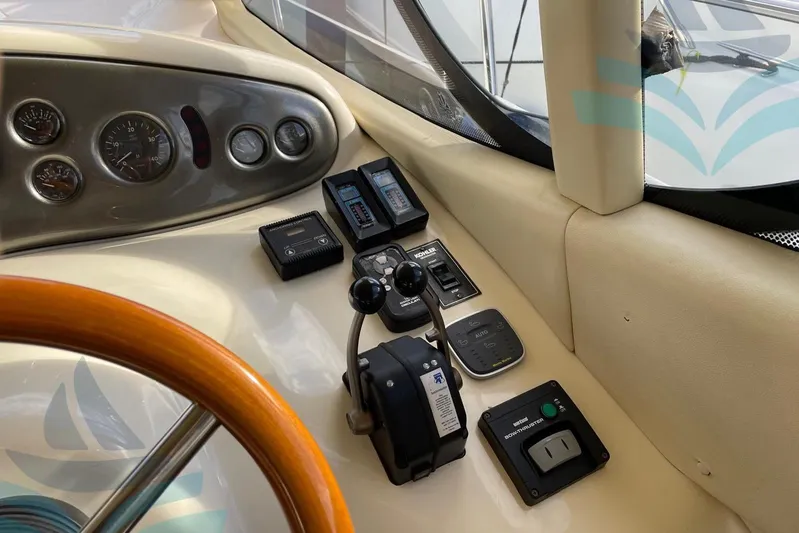  Yacht Photos Pics Control panel of a 2001 Azimut 42 Fly yacht with steering wheel and gauges.