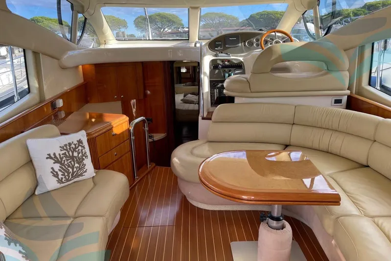  Yacht Photos Pics Luxurious interior of 2001 Azimut 42 Fly yacht with elegant seating and wooden accents.