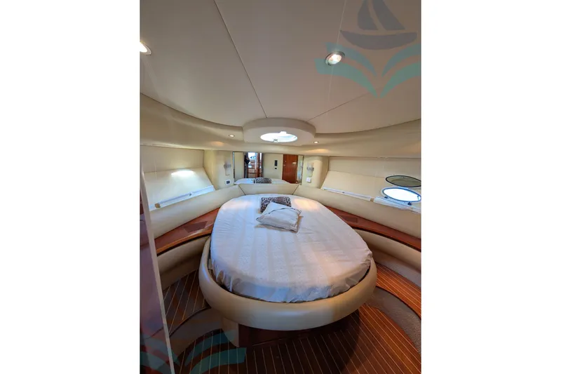  Yacht Photos Pics Luxurious interior of 2001 Azimut 42 Fly yacht with elegant bedroom design.