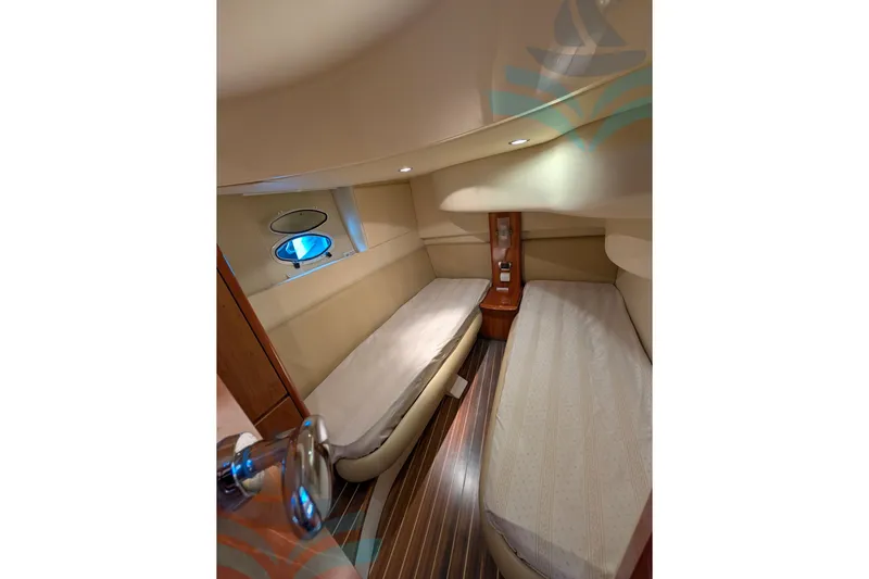  Yacht Photos Pics Interior cabin of 2001 Azimut 42 Fly yacht with twin beds and porthole window.