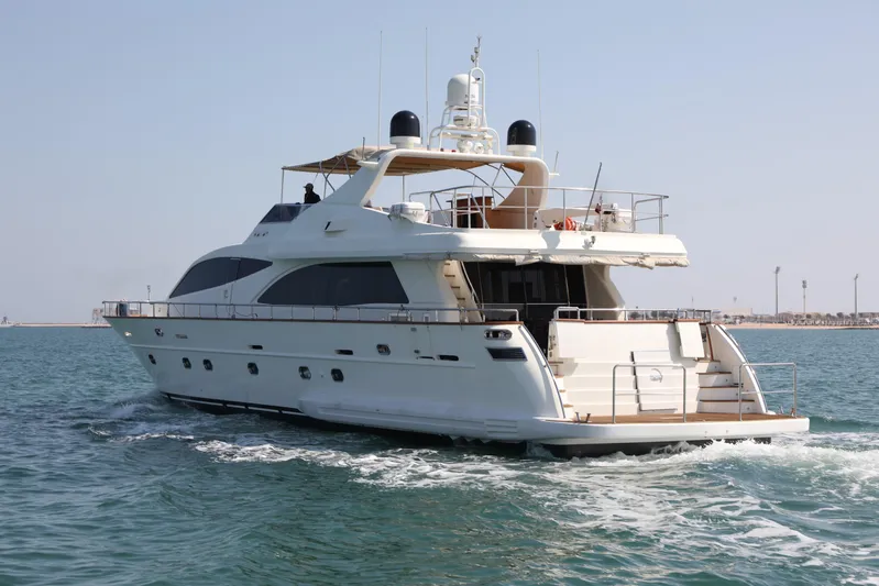  Yacht Photos Pics Luxury Falcon 90 yacht cruising on open water, 2005 model.