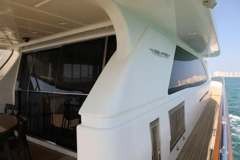  Yacht Photos Pics Luxury Falcon 90 yacht, 2005 model, cruising on open water with sleek design.