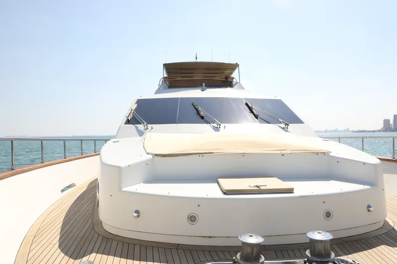  Yacht Photos Pics Luxury Falcon 90 yacht from 2005 on open water, showcasing sleek design and spacious deck.