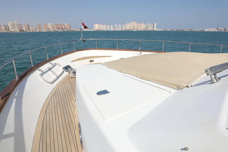  Yacht Photos Pics Luxury Falcon 90 yacht deck with city skyline in the background, 2005 model.