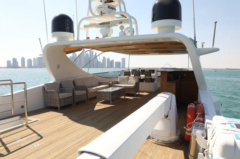  Yacht Photos Pics Luxurious Falcon 90 yacht deck with seating, city skyline view, 2005 model.
